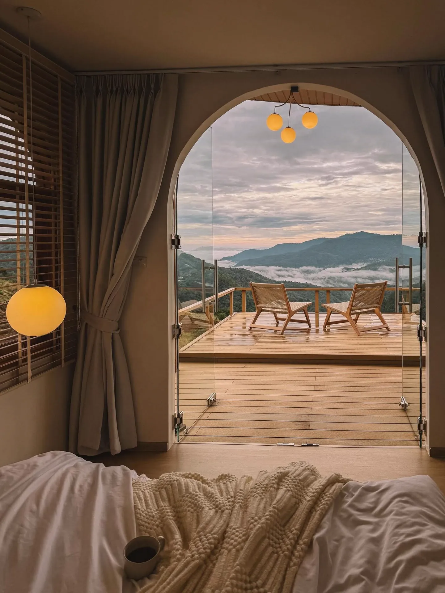 Mountain view through the arched bedroom door