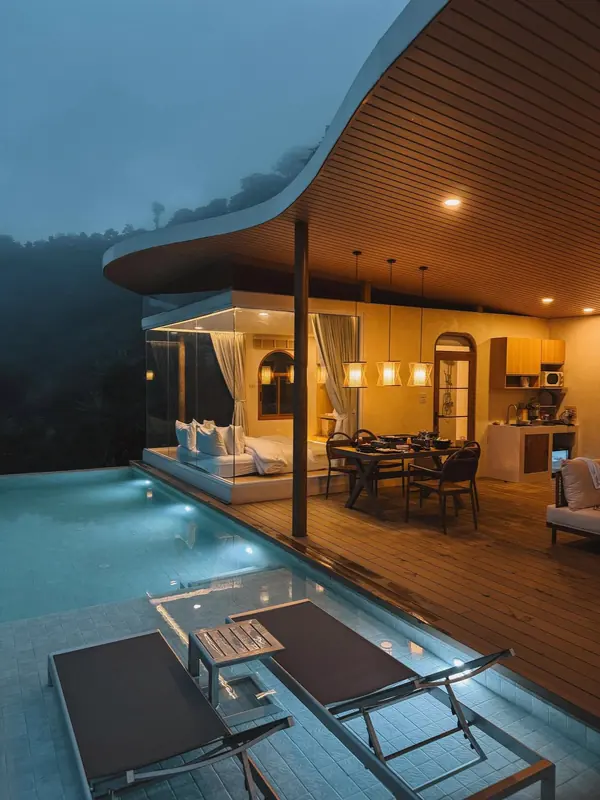 Villa and pool at night
